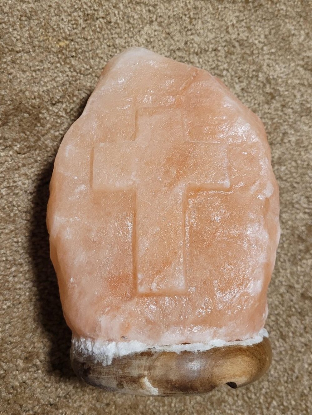 Hand-carved Himalayan pink salt lamp featuring an engraved cross w/o light